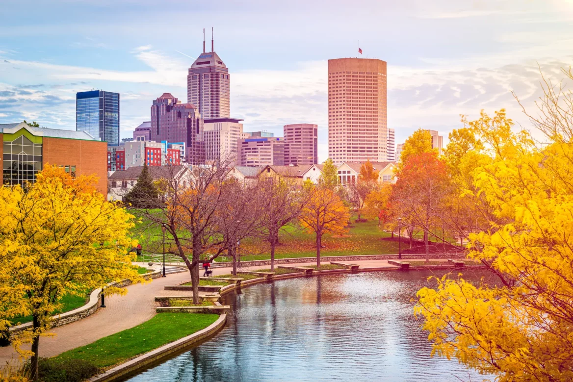 Autumn river walk in Indianapolis with city skyline in the background