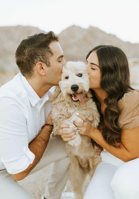 Nassim & Faraz Kissing Their Puppy