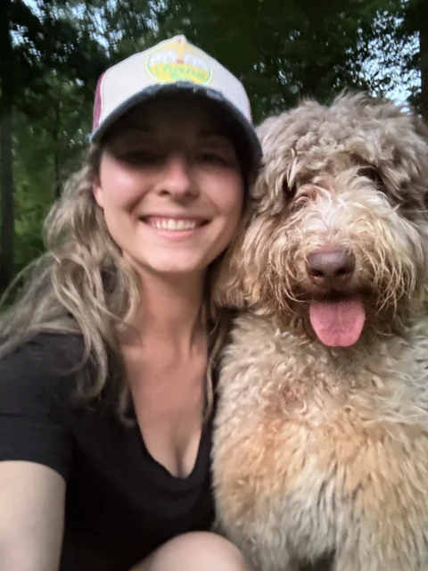 Owner taking selfie with her Bernedoodle