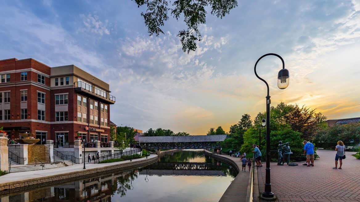 People walking beside the river in Naperville, IL