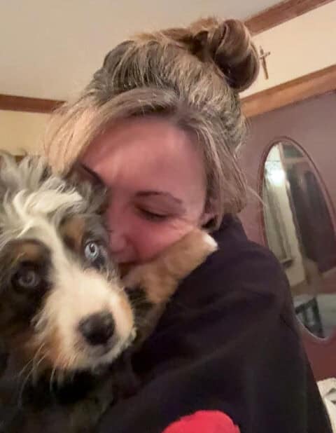 Tanya Nelson hugging puppy